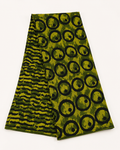 Pagne wax africain avec motif imprimé, dans des tons verts.